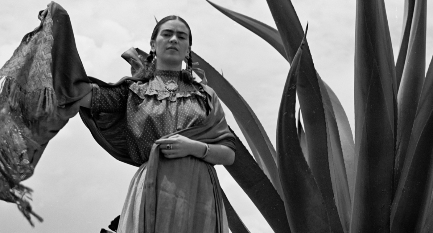 Frida Kahlo standing next to an agave plant, by Toni Frissel